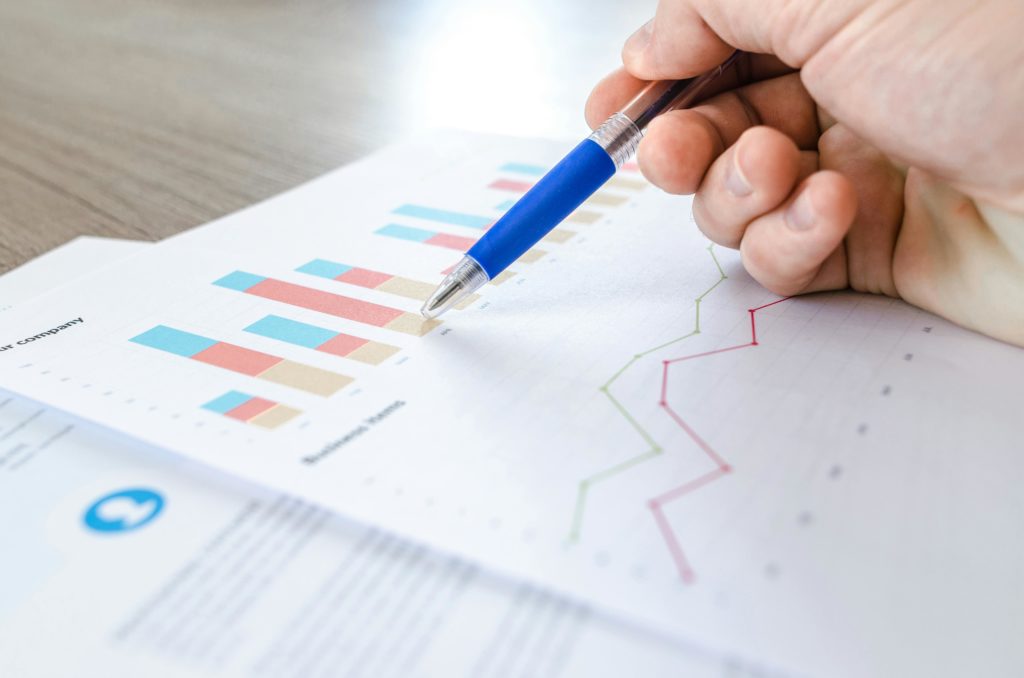 Professional analysing market research survey data with charts and graphs.